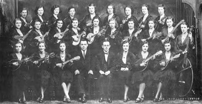 Photo of the Winnipeg Girls Mandolin Orchestra from the early 1930s. Angela is located second from the left in the back row. Her sister Ollie is at the far right in the same row.